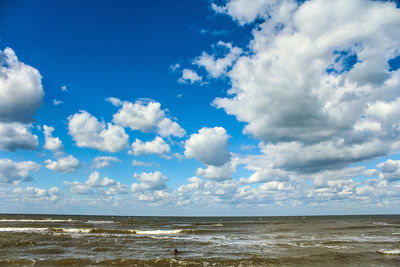 Scenic view of sea against blue sky