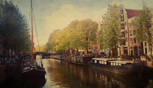 Boats moored in canal