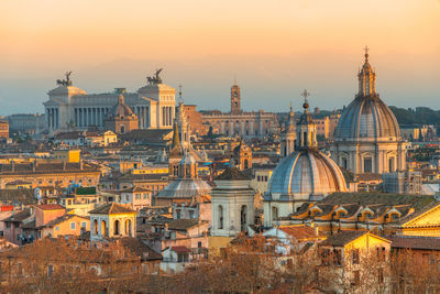 High angle view of historic cityscape against sky during sunset