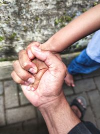 Close-up of man holding hands