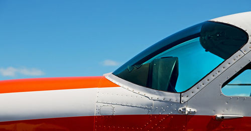 Close-up of airplane against sky