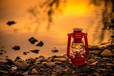 Fire hydrant on rock during sunset