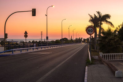 View of road against sky during sunset