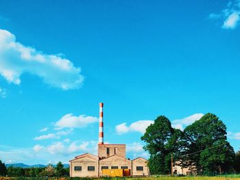 Low angle view of building against blue sky