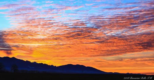 Scenic view of dramatic sky during sunset