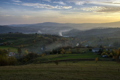 Scenic view of landscape against sky during sunset