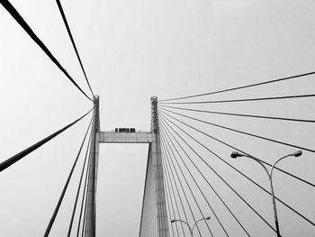 Low angle view of cables against the sky