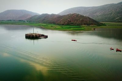 Scenic view of boats in lake