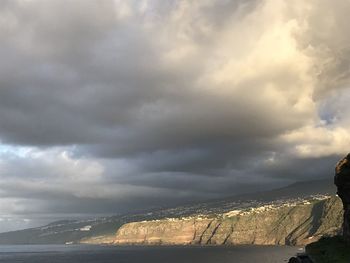 Scenic view of sea against cloudy sky