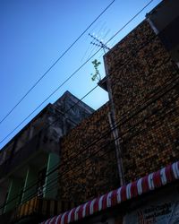 Low angle view of buildings against blue sky