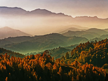 Scenic view of mountains against sky during sunset