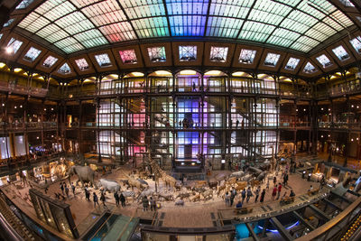 High angle view of people in illuminated room