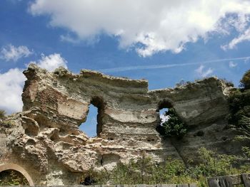 Low angle view of old ruins against sky