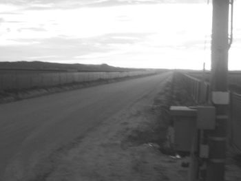 Empty road along landscape