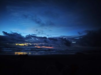 Scenic view of sea against sky at night