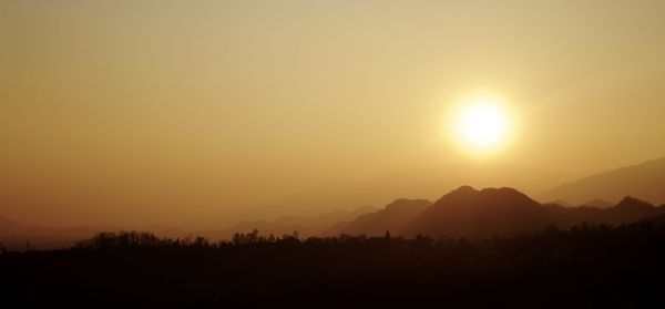 Scenic view of mountains at sunset