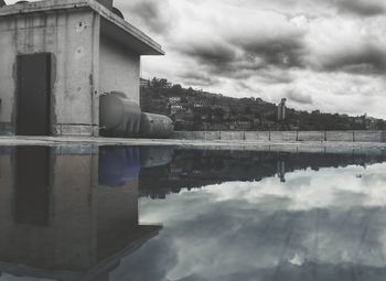 Built structures against cloudy sky