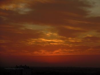 Scenic view of dramatic sky during sunset