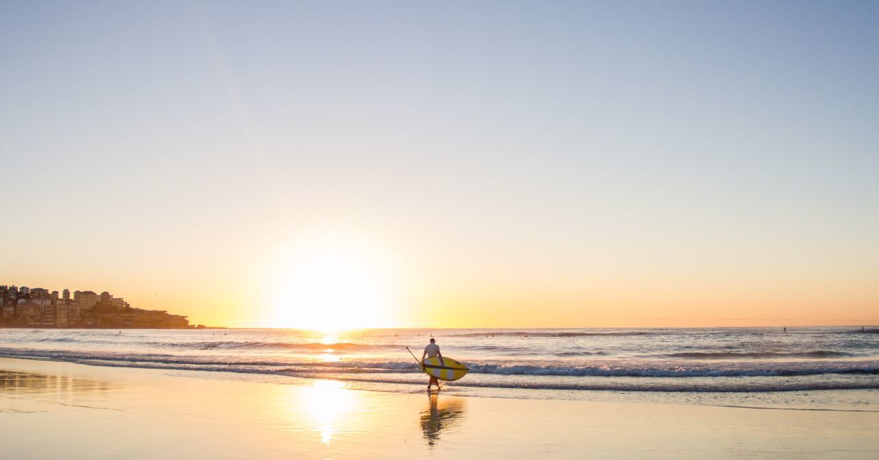 sunset, sea, one person, water, one man only, real people, outdoors, beach, sun, nature, clear sky, silhouette, vacations, adults only, adult, beauty in nature, horizon over water, sky, people, only men, day