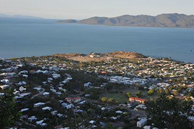 High angle view of sea and buildings against sky