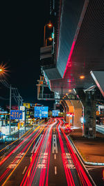 Light trails on road in city at night