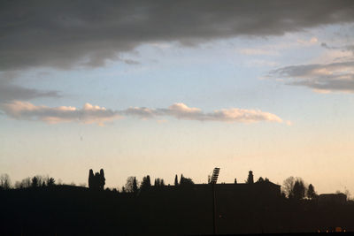 Low angle view of silhouette buildings against sky during sunset