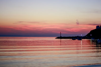 View of sea against cloudy sky during sunset