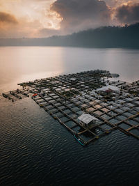 High angle view of built structure on sea during sunset