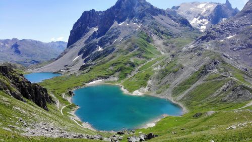 Scenic view of lake and mountains against sky