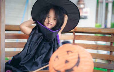 Portrait of cute smiling girl wearing halloween costume