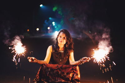 Full length of woman standing at night