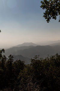 Scenic view of mountains against sky at sunset