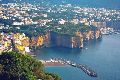 High angle view of townscape by sea