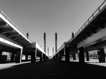 Low angle view of bridges against clear sky