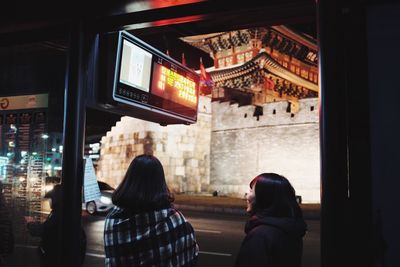 Rear view of woman walking in city