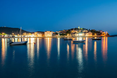 Reflection of illuminated buildings in water