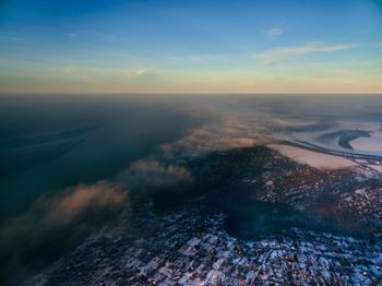 Aerial view of landscape against sky during sunset