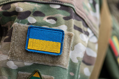 Flag of ukraine, ukrainian army or armed forces on a patch of a soldier military uniform, close up