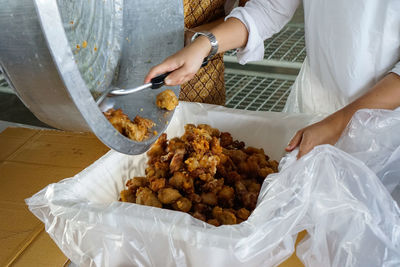 High angle view of woman preparing food on table