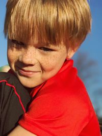 Portrait of boy smiling outdoors