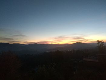 Scenic view of silhouette landscape against sky during sunset