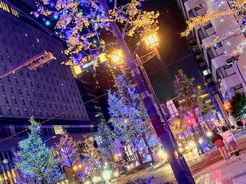 Low angle view of illuminated buildings at night