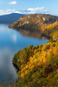 Scenic view of lake against sky during autumn