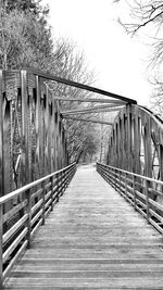 Footbridge leading to wooden bridge