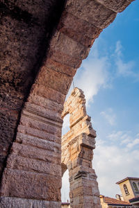 Low angle view of old ruin building against sky