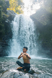 Playing in the waterfall