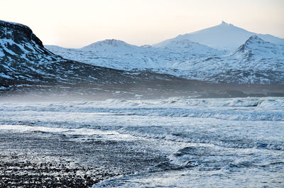 Scenic view of snowcapped mountains against sky