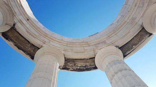 Low angle view of historical building against blue sky