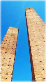 Low angle view of built structure against blue sky