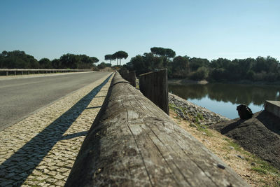 Scenic view of calm lake against clear sky